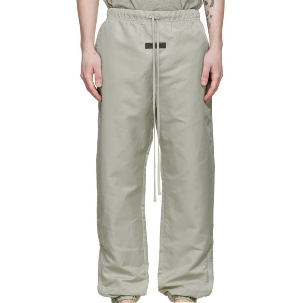 FEAR OF GOD ESSENTIALS
Green Nylon Track Pants